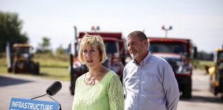 Ontario Minister of Infrastructure Laurie Scott announced $790,000 to help the municipality of Kawartha Lakes improve public transit on August 16, 2019 at Lindsay Transit's bus maintenance facility in Lindsay. Pictured in the background is Kawartha Lakes Mayor Andy Letham. (Photo: Office of Laurie Scott)