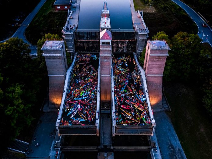 Decorated and lit canoes and kayaks fill the two tubs of the Peterborough Lift Lock during the annual Lock & Paddlee event on August 24, 2019. The fourth annual event, presented by the Peterborough Lift Lock National Historic Site of Canada (Parks Canada) in co-operation with The Canadian Canoe Museum, was held in the evening for the first time. (Photo: Justen Soule / Trent-Severn Waterway)