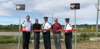 Two Project Safe Trade parking spots were launched at the Kawartha Lakes OPP Detachment in Lindsay on August 15, 2019. Pictured are Municipal Law Enforcement Manager Aaron Sloan, Mayor Andy Letham, Inspector Tim Tatchell, Councillor Ron Ashmore, and Staff Sergeant Robert Flindal. (Photo courtesy of the municipality of Kawartha Lakes)