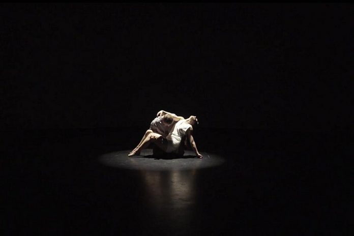 Through spoken word and original music and choreography, "Surfacing" explores the impact of mental illness and suicide on writer Frank Flynn's family. Originally intended to be a live dance performance, it was instead turned into a film that is now available for online viewing. Pictured are dancers Oliver Moriarty and Sierra Richardson.  (Screenshot)