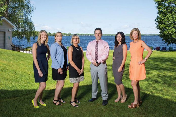 The team of The Pyle Group of ScotiaMcLeod: Administrative Associate Tammy Sargeant, Senior Associate Brittany Beach, Investment Associate Eileen Huggins, Portfolio Manager and Senior Wealth Advisor Andrew Pyle, Wealth Advisor Ally Pyle, and Investment Associate Emily Downie. (Photo courtesy of Dockside Magazine)