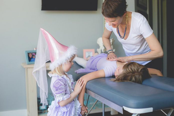 Chiropractor Dr. Ange Wellman working on a young client at her downtown Peterborough office. Dr. Ange uses the very gentle torque release method, which is focused more on the nervous system and creating ease in the body. It's an ideal approach for her family practice. She has completed the Epic Pediatrics Training Program and is currently in the process of completing her International Chiropractic Pediatric Association Certification. (Supplied photo)