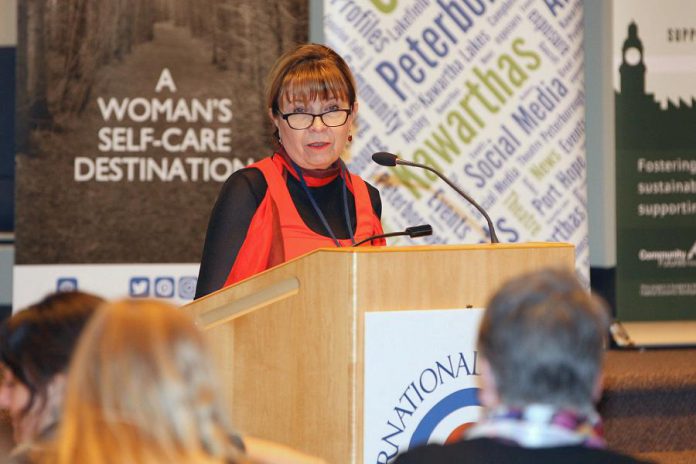 The Ear Depot owner and operator Brenda Cowan, shown here speaking at the Peterborough International Women's Day Conference, understands that developing insightful and understanding relationships with her clients is the most important step in helping them with their hearing needs. (Photo: IWD Peterborough)