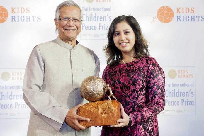 Youth activist Kehkashan Basu, pictured here at 16 years old receiving the 2016 International Children's Peace Prize from Nobel Peace Prize laureate Muhammad Yunus in The Hague, is one of the inspiring speakers on the 2019-20 program of the Women's Business Network of Peterborough. (Photo: Rick Nederstigt / ANP)