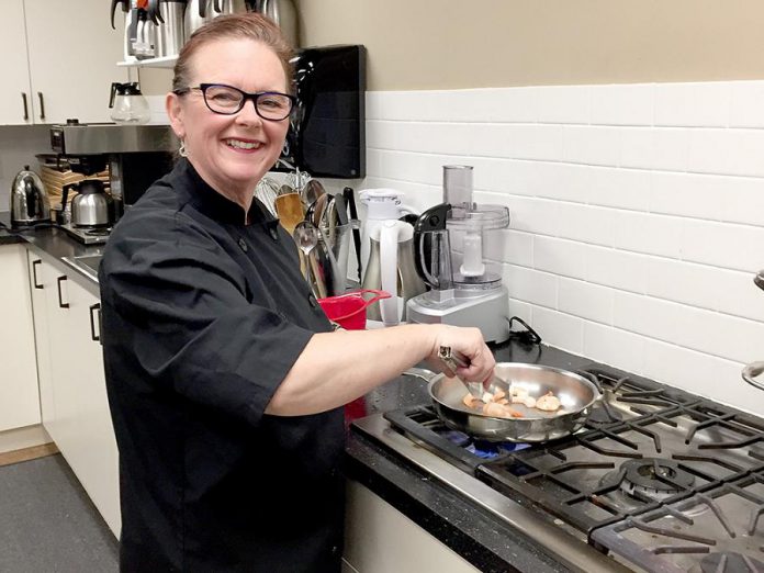 Chef Tracey Ormond at work in her state-of-the-art commercial kitchen at Ashburnham Funeral and Reception Centre in Peterborough, where she and her team prepare fresh catered food for clients of That's a Wrap Catering and delicious and nutritious ready-to-eat meals for clients of Classic Cooking including seniors. (Supplied photo)