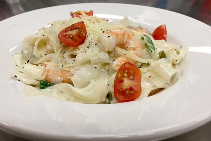 This dish of pan-seared shrimp alfredo over glass noodles with marinated grape tomatoes is an example of the fresh and healthy meals that Tracey Ormond prepares for Classic Cooking, a meal delivery service for seniors and families in Peterborough that Tracey operates with Sally Harding of Nightingale Nursing. (Supplied photo)