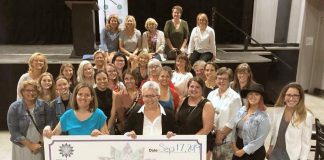 Casa De Angelae resident Katie Galloro and board chair Kim Aubin with some of the members of 100 Women Peterborough. The Peterborough home for women living with developmental disabilities will receive more than $10,000 from the group. (Photo courtesy of 100 Women Peterborough)