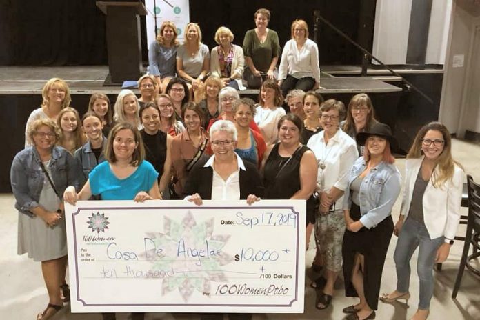 Casa De Angelae resident Katie Galloro and board chair Kim Aubin with some of the members of 100 Women Peterborough. The Peterborough home for women living with developmental disabilities will receive more than $10,000 from the group. (Photo courtesy of 100 Women Peterborough)