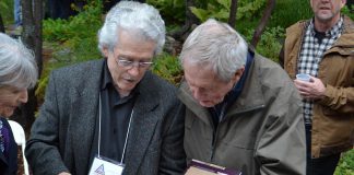 Renowned Canadian wildlife artists Michael Dumas and Robert Bateman in Algonquin Park at the 75th anniversary fundraiser for the Algonquin Wildlife Research Station on September 14, 2019, where Bateman was presented with the 2019 Algonquin Park Legacy Award by Dumas, the inaugural recipient of the award from the Algonquin Art Centre. Dumas also presented Bateman with a limited edition of "The Artists of Kawartha", the fourth art book in a series designed and published by Algonquin-area publisher Andrea Hillo. (Photo courtesy of Andrea Hillo)