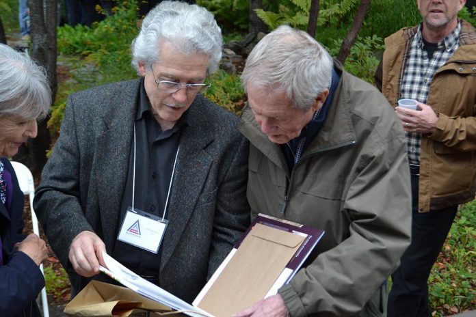 Renowned Canadian wildlife artists Michael Dumas and Robert Bateman in Algonquin Park at the 75th anniversary fundraiser for the Algonquin Wildlife Research Station on September 14, 2019, where Bateman was presented with the 2019 Algonquin Park Legacy Award by Dumas, the inaugural recipient of the award from the Algonquin Art Centre. Dumas also presented Bateman with a limited edition of "The Artists of Kawartha", the fourth art book in a series designed and published by Algonquin-area publisher Andrea Hillo. (Photo courtesy of Andrea Hillo)