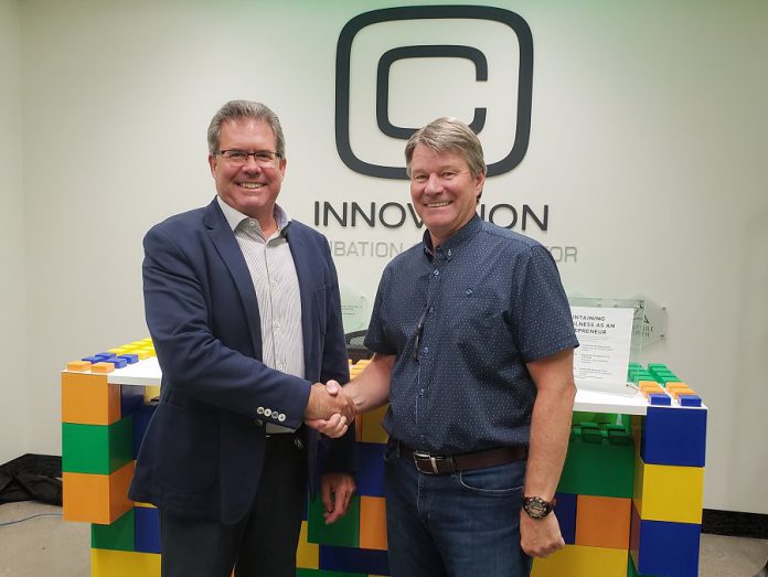 Pat Devlin of Peterborough Utilities Group and John Gillis of Innovation Cluster Peterborough and the Kawarthas. (Photo courtesy of Innovation Cluster)