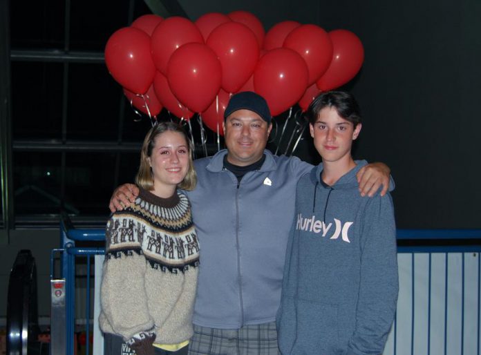 Locals Halle and her brother Lucas, shown here with their dad Zak at the special screening of "IT Chapter Two" at Rainbow Cinemas in Cobourg, both appeared as extras in the film. (Photo: April Potter / kawarthaNOW.com)