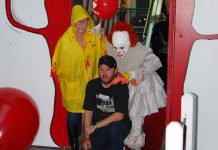 Adam Pearson, owner of Queenies Bake Shop, at a special screening of "IT Chapter Two" at Cobourg's Rainbow Cinemas in Northumberland Mall on September 5, 2019, along with costumed fans Laurie Statt and Melindah Knott. Pearson, with the help of local artists and volunteers, created a large-scale art project for the screening which also raised funds for the Northumberland Fare Share Food Bank. Pearson, whose Port Hope business benefited from the production of the film, appears as an extra who get shoved out of the way by actor James McAvoy during the film's funhouse scene. (Photo: April Potter / kawarthaNOW.com)