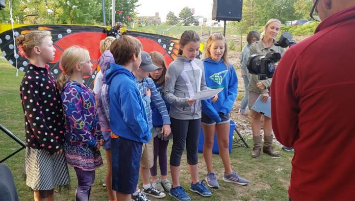 Students from Edmison Heights Public School in Peterborough released a monarch butterfly and read an ode to the threatened pollinator.  (Photo: Jeannine Taylor / kawarthaNOW.com)