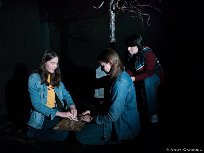 In Planet 12 Productions' original play "Tex", Samuelle Weatherdon, Aimee Gordon, and Emily Keller star as three girls who use an Ouija board on Halloween and contact a spirit who calls himself Tex and leads the girls into a local cemetery in search for the answers to a gruesome murder from their town's past. The show runs from September 25 to 28, 2019 at The Theatre on King in downtown Peterborough. (Photo: Andy Carroll)