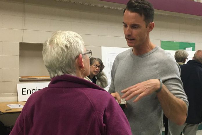 Ashburnham Realty owner Paul Bennett (right), who is developing a number of East City properties for mixed-use residential-commercial purposes, interacted with a number of residents Thursday night (October 24) who attended an open house and information session at Mark Street United Church.  (Photo: Paul Rellinger / kawarthaNOW.com)