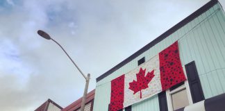 Hospice volunteers have hand crafted this large Canadian flag of poppies, which is hanging at Vintage on Hastings, the shop operated in downtown Bancroft by Hospice North Hastings. In previous years, hospice volunteers have used their skills for other large-scale projects to commemorate Remembrance Day. (Photo: Barb Shaw)
