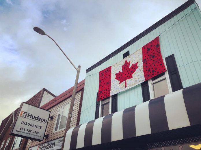 Hospice volunteers have hand crafted this large Canadian flag of poppies, which is hanging at Vintage on Hastings, the shop operated in downtown Bancroft by Hospice North Hastings. In previous years, hospice volunteers have used their skills for other large-scale projects to commemorate Remembrance Day. (Photo: Barb Shaw)