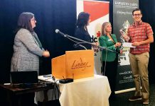 Dan Kitchen of Servo Socks (right) accepting the grand prize from Dawn Hennessey of the Business Development Bank of Canada at the Kawartha Lakes Small Business Innovation Awards in Lindsay on October 25, 2019. (Photo: Servo Socks / Facebook)