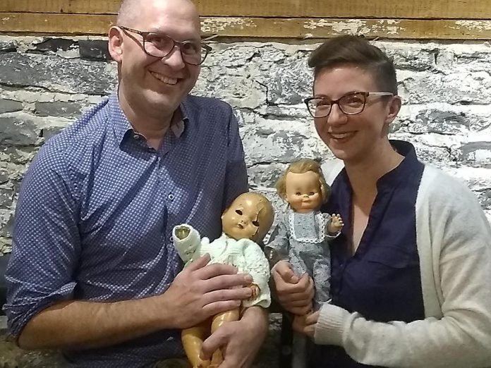 Ben Hatcher and Kathryn Bahun with two of the dolls from their collection, which will be on display at The Theatre on King in downtown Peterborough on October 29 and 30, 2019. (Photo: Sam Tweedle / kawarthaNOW.com)