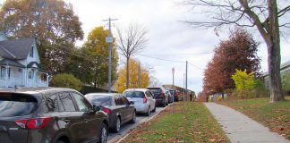 A common sight at Peterborough-area schools during drop-off and pick-up times: a long line of idling cars on Robinson Street beside Immaculate Conception Catholic Elementary School in Peterborough's East City. Empty sidewalks are an indication that there is potential to shift towards active methods of school travel instead of relying on cars. Relying on cars for school travel reduces air quality, physical activity, and opportunities for independence while also increasing social isolation. To help address these issues, Immaculate Conception is one of five local schools participating in the new School Travel Planning program delivered by GreenUP and Active and Safe Routes to School Peterborough. (Photo courtesy of GreenUP)