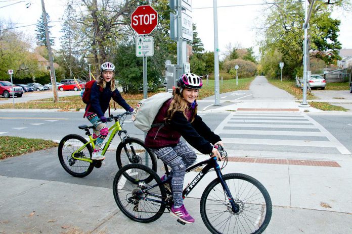 Children ride their bikes at the Rotary Greenway Trail at Douro Street in Peterborough's East City. Whereas relying on cars for school travel can increase isolation and reduce physical activity, cycling or walking to school with friends can provide valuable social and active time for kids. (Photo courtesy of GreenUP)