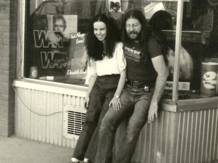 Mike Taveroff with his wife Cheryl in front of their original Moondance store at 249 George Street in downtown Peterborough in 1975. One of the reasons Mike decided to close the store in 2018 and retire was the death of Cheryl from cancer the previous year. Shortly after retiring, Mike was himself diagnosed with cancer and, after initial treatment made him ill, he decided to halt future treatments in favour of palliative care. His two daughters Jesse and Leigh and his close friend and former long-time Moondance employee Sue Logan were with him when Mike passed away in hospice on October 13, 2019. (Photo courtesy of the Taveroff family)