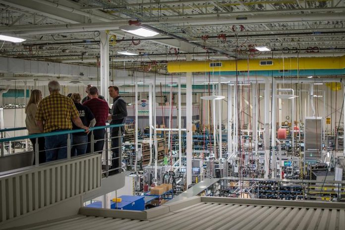 A Siemens Peterborough employee gives a tour to 40 educators from the Kawartha Pine Ridge District School Board and the Peterborough, Victoria, Northumberland and Clarington Catholic School Board on Wednesday, October 9, 2019.  (Photo: Alyssa Cymbalista)