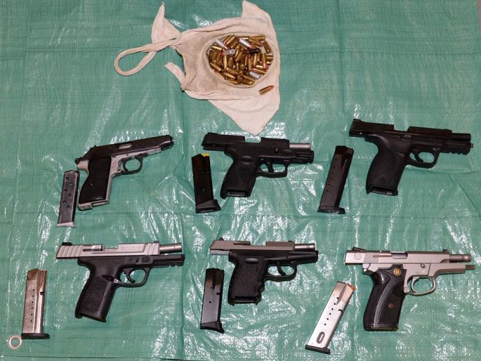 Police found these six handguns conealed in a hidden compartment in a car driven by one of the 11 people arrested after a joint police force investigation resulted in 13 search warrants being executed on October 30, 2019 in several communities in and around the Kawarthas. Police also seized significant quantities of drugs, cash, and other weapons. (Supplied photo)