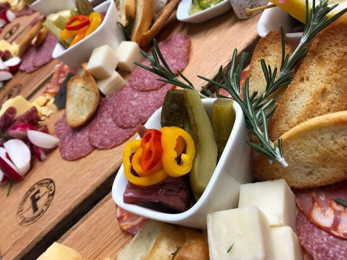 The taproom showcases Fenelon Falls Brewing Co.'s craft beers paired with an all-day menu, created using local and seasonal ingredients, including shared bites and charcuterie platters. (Photo: Fenelon Falls Brewing Co.)