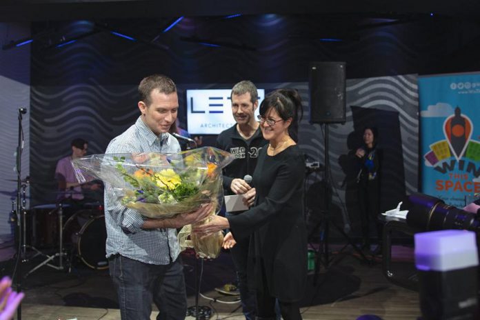 Jonathan MacKay of Sustain Eco Store accepting the grand prize for the 2019 Win This Space contest. Jonathan and his wife and co-owner Celine are hosting an official grand opening celebration of their new downtown Peterborough location on November 7, 2019. (Photo courtesy of Peterborough DBIA)