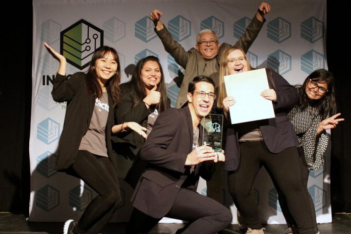 Members of the Enactus Fleming College team behind Paper Plant Project (with Fleming College professor of business studies and lead Enactus faculty advisor Raymond Yip Choy at the back) celebrating their win of the grand prize at the fifth annual Cubs' Lair entrepreneurship competition, held on November 21, 2019 at the Gordon Best Theatre in downtown Peterborough. This is the third prize since September for the Paper Plant Project, a social enterprise that produces paper planters from recycled paper waste as educative kits for schools to promote biodegradable practices. (Photo courtesy of Innovation Cluster)