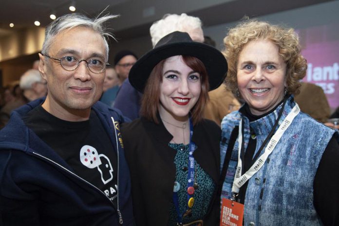 ReFrame programmer Lester Alfonso (left) and board member Deborah Berrill (right) unwind with local filmmaker Slater Jewell-Kemker following the 2019 opening night screening of "Youth Unstoppable". The opening night screening for the 2020 ReFrame Film Festival takes place at Showplace Performance Centre on Thursday, January 23rd, with the film to be announced soon. (Photo: Natelie Herault)