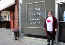 Rose Wilton, founder of The Rose Project, in front of Sugar Dust Bakery on Walton Street in Port Hope where you can donate toiletries or warm gloves, mittens, and hats for people in need. You can also bring donations to The Rose Project's inaugural Holiday Craft Show at the Town Park Recreation Centre on November 23, 2019, which features vendors offering a selection of hand-crafted items for your holiday shopping. (Photo: April Potter / kawarthaNOW.com)