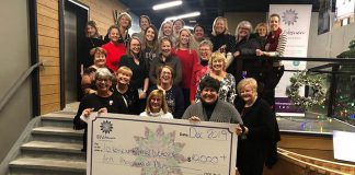 Members of collective philanthropy group 100 Women Peterborough present their donation of more than $10,000 to Lakefield Animal Welfare Society in the lobby of the VentureNorth building in downtown Peterborough on December 17, 2019. The "no-kill" animal shelter was selected by members to receive the donation from the group, which has now raised around $100,000 for eight local charities. (Photo courtesy of 100 Women Peterborough)