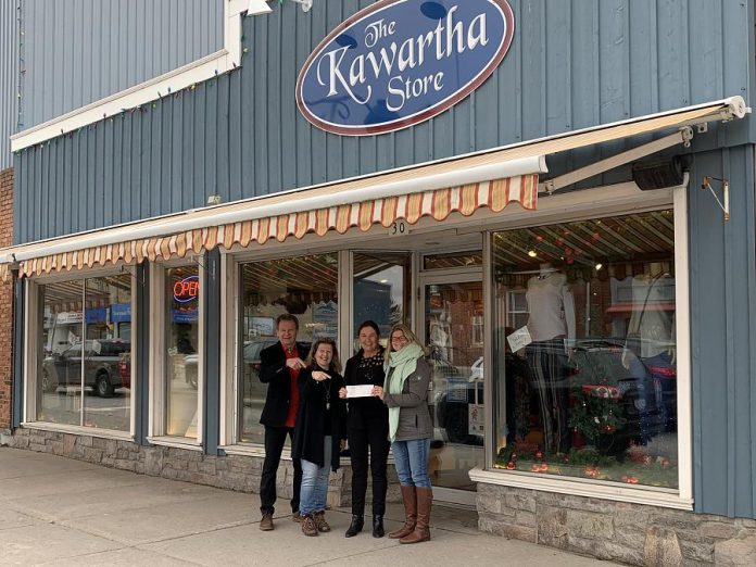 The Kawartha Store owners Al McIntosh (left) and  Trish Dougherty (second from right) with manager Trina Hubner (second from left) and Fenelon Falls and District Chamber of Commerce general manager Marylee Boston (right) with a cheque for $1,000 after The Kawartha Store won the Fenelon Falls Downtown Revitalization Award. (Supplied photo)