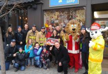 The Peterborough Professional Firefighters are donating $2,000 to The Toy Shop in downtown Peterborough so owner Jean Grant can use the funds to n to leverage deals for more than $6,000 worth of toys from her suppliers, who help with the initiative. The toys will be donated to the annual Salvation Army Toy Drive. (Photo courtesy of Peterborough DBIA)