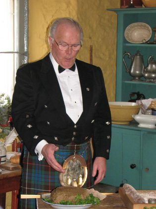 Hutchison House's Hogmanay celebration on New Year's Day includes a rousing rendition of 'Burns' Address to a Haggis', performed in a traditional Scottish brogue, a performance that involves slicing into the haggis, supplied for the occasion by Franz's Butcher Shop. (Photo: Hutchison House Museum)