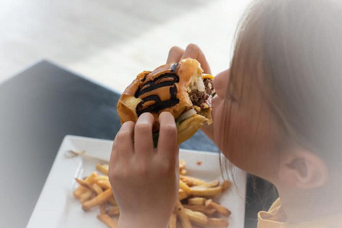 Peterburgers owners Nicole Comber and Roy Asselsetine worked for two months developing their signature burger recipe. (Photo: Happy Heart Photography)