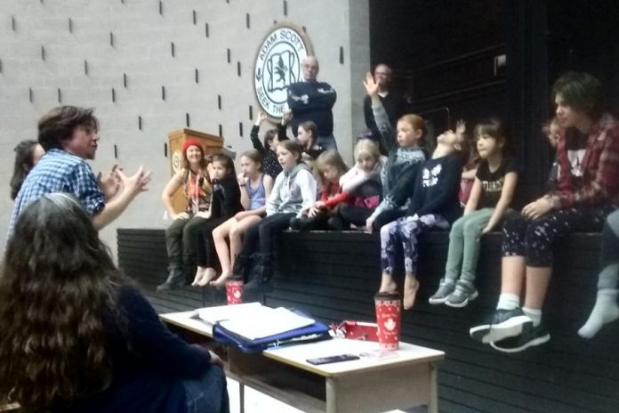 Writer and director Em Glasspool (left, gesturing)  speaks to cast members of Arbor Theatre's original production "Real Rad Red Riding Hood" during a rehearsal in early December at Adam Scott Collegiate Vocational Institute. There will be a public performance of the play  on December 12, 2019 at Showplace Performance Centre in downtown Peterborough. (Photo: Sam Tweedle / kawarthaNOW.com)