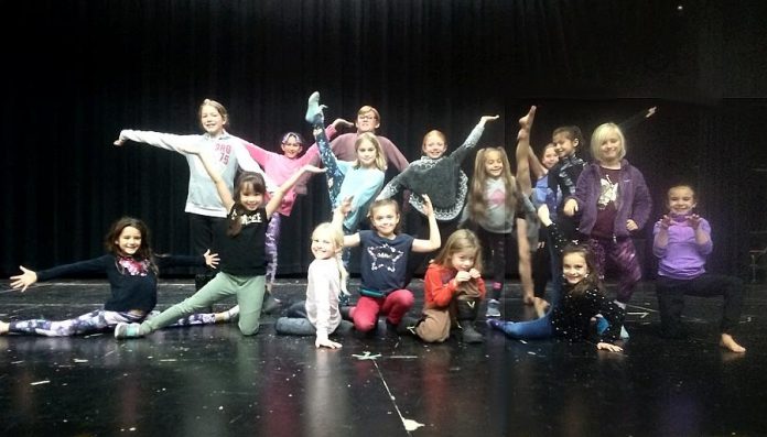 Young members of the cast who portray flowers and dancers  in Arbor Theatre's original production "Real Rad Red Riding Hood", during a rehearsal in early December at Adam Scott Collegiate Vocational Institute. There will be a public performance of the play on December 12, 2019 at Showplace Performance Centre in downtown Peterborough. (Photo: Sam Tweedle / kawarthaNOW.com)