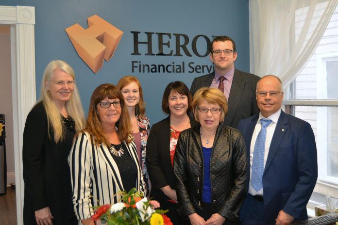 Roberta Herod (far left) started in the financial services business in the early 2000s, obtained her license to sell mutual funds, and threw herself behind the effort to grow Herod Financial Services, which was founded by her spouse Kevan Herod (far right). The company now has locations in Peterborough and Lakefield and seven team members.  (Supplied photo)