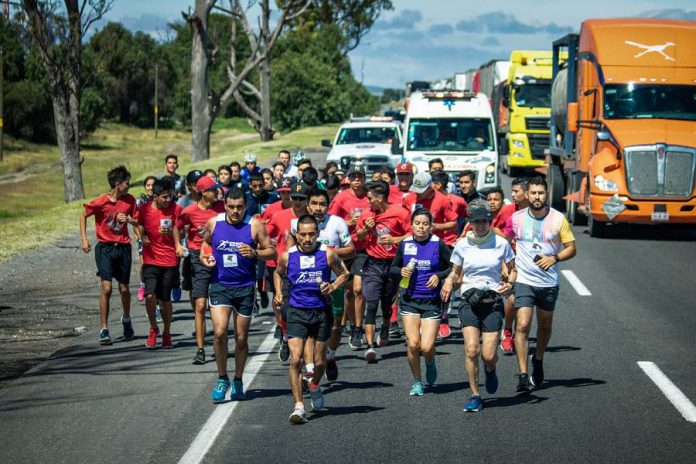 The Monarch Ultra was a 4,300-kilometre international relay run from Canada to Mexico that took place over seven weeks in fall 2019, following the migratory journey of the endangered Monarch butterfly. Pictured is ultra runner Martha Ravelero, who was joined by the Red Devils Baseball Team, runners, and cyclists from San Luis de la Paz, Guanajuato in Mexico. (Photo: Rodney Fuentes)