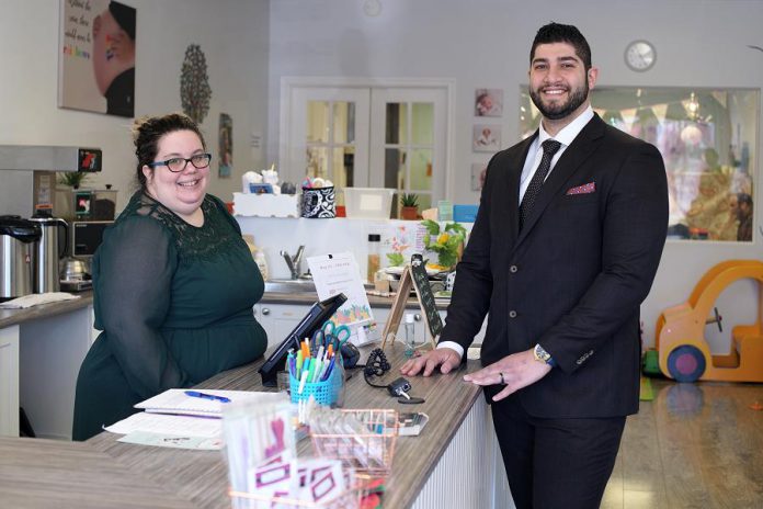 While Dabbah Corp works with both large and small companies, owner Waleed Dabbah (pictured here with client Sarah Susnar, owner and operator of family activity studio Play Cafe) says his company's services are especially beneficial to small businesses. (Photo: 705 Creative / kawarthaNOW)