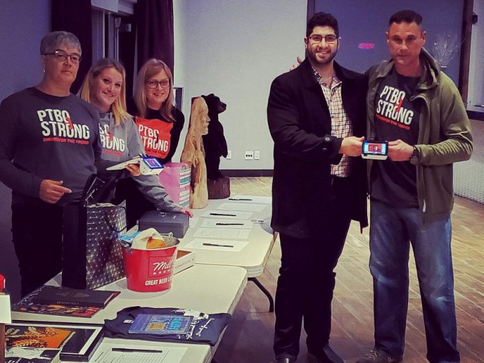 Dabbah Corp owner Waleed Dabbah (second from right) with fellow board member Tim Burke of PTBOstrong, an advocacy group formed in 2015 to raise awareness, education, and funds to support the opioid addiction and homelessness crisis in Peterborough. Dabbah Corp donated a Poynt Smart Terminal so the organization can better to track merchandise sales for fundraising. (Photo supplied by Dabbah Corp)