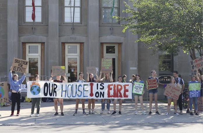 Students gather for a climate change protest at Peterborough City Hall in a still from "You(th)". The short film by local high school student Nico Ossa opens the 16th annual ReFrame Film Festival at Showplace Performance Centre on Thursday, January 23rd, accompaning the award-winning feature-length Peruvian documentary "Máxima" that premiered at Hot Docs 2019. Both documentaries speak to the power of individuals to make change. (Photo courtesy of ReFrame)