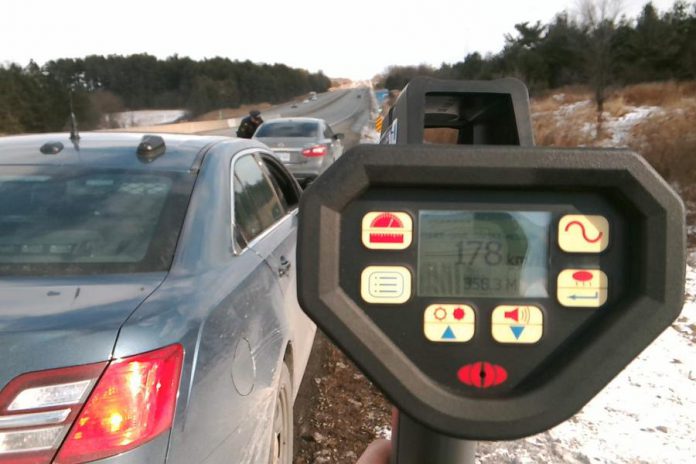 Police stop a motorist on Highway 401 in the Port Hope area who was driving at 178 km/h, one of five drivers charged by police with stunt driving in a six-hour period on January 8, 2020. (Supplied photo)