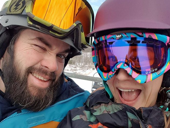 Wade Hartin and his wife Emily snowboarding. Wade was killed in an accident on January 14, 2020 while working working at his job as a snow grooming machine operator at Dagmar Ski Resort near Uxbridge. Emily is due to give birth to the couple's first child in April, and a GoFundMe campaign has been set up to support Emily and Baby Hartin.   (Photo supplied by Ashley Webster)