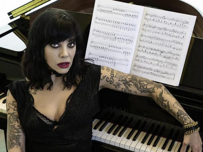 Indo-Canadian singer-songwriter Beth Torbert, better known by her stage name Bif Naked, will be performing with her husband Steve "Snake" Allen at the Market Hall in downtown Peterborough on March 4, 2020 as part of her Songs And Stories 2020 tour. She will play her punk, pop and alt-rock tunes, including from her upcoming album "Champions", and will be reading excerpts from her 2016 memoir. Toronto singer-songwriter Frank Moyo will be opening. (Photo: Coco & Kensington Photography)