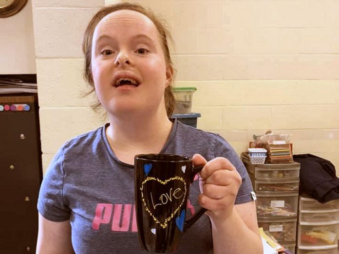 The Biz Group's custom, hand-painted "love mugs" are available for $10 each, with all proceeds going to Biz Group members. (Photo courtesy of Down Syndrome Association of Peterborough)